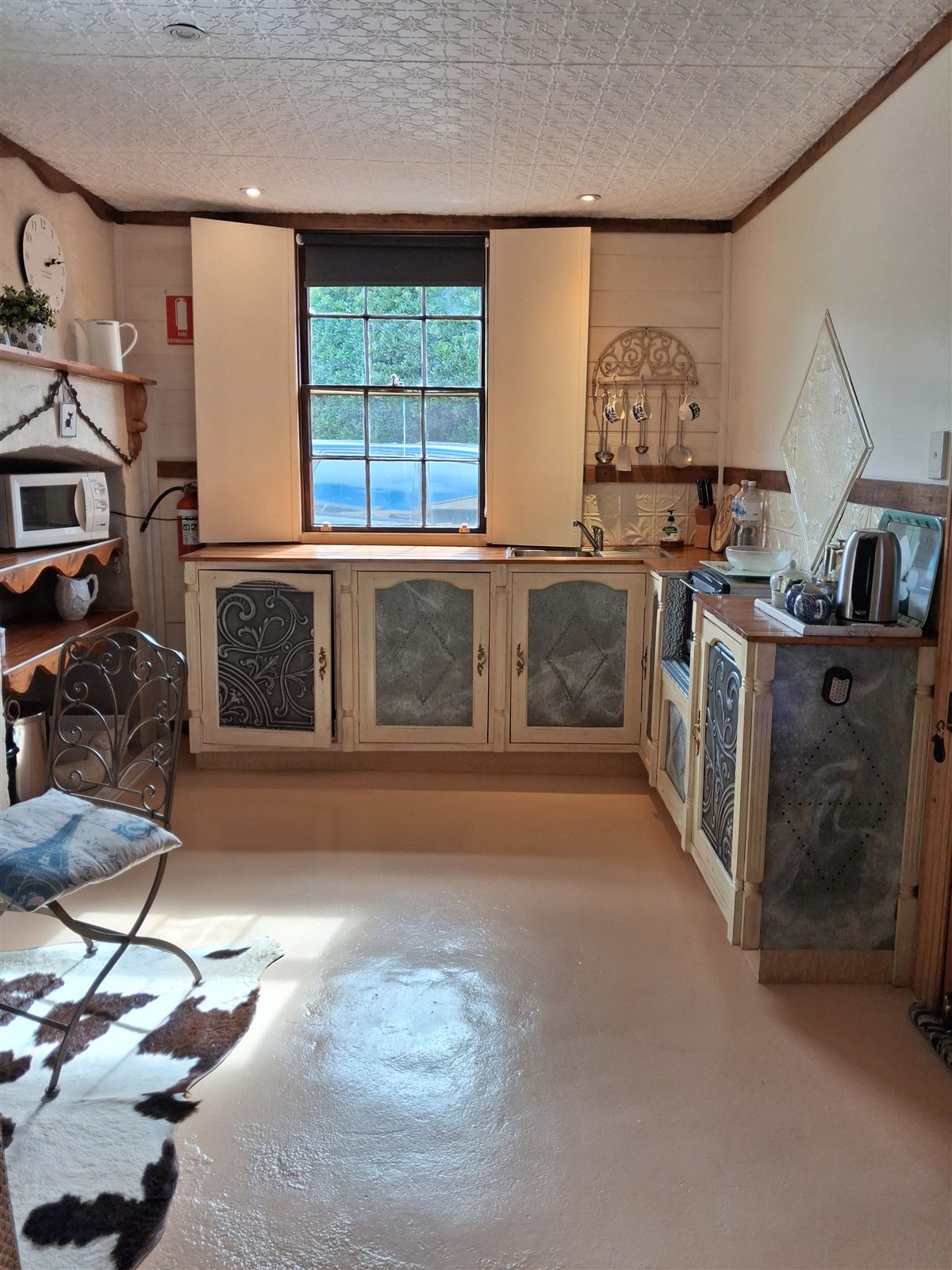 Restored farmhouse-style kitchenette in La Petite Maison